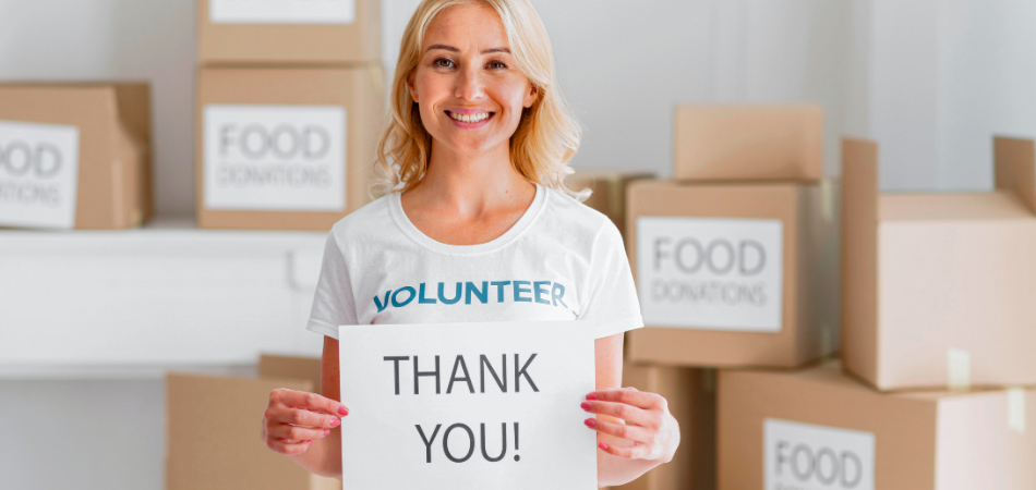 Lady holding a Thank You sign 