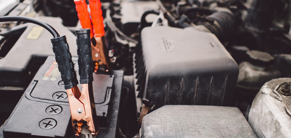 Jumping cables attached to a car